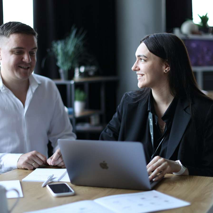Two professionals discussing work.
