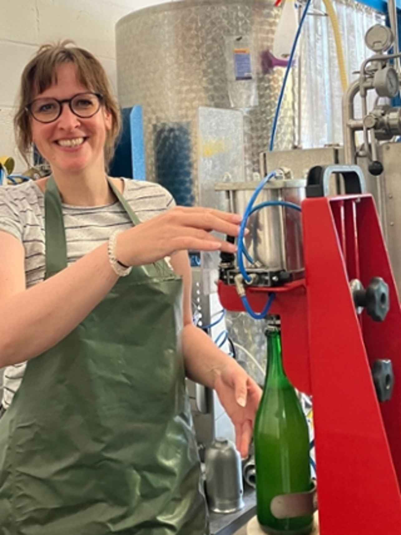 Woman preparing bottles for storage.