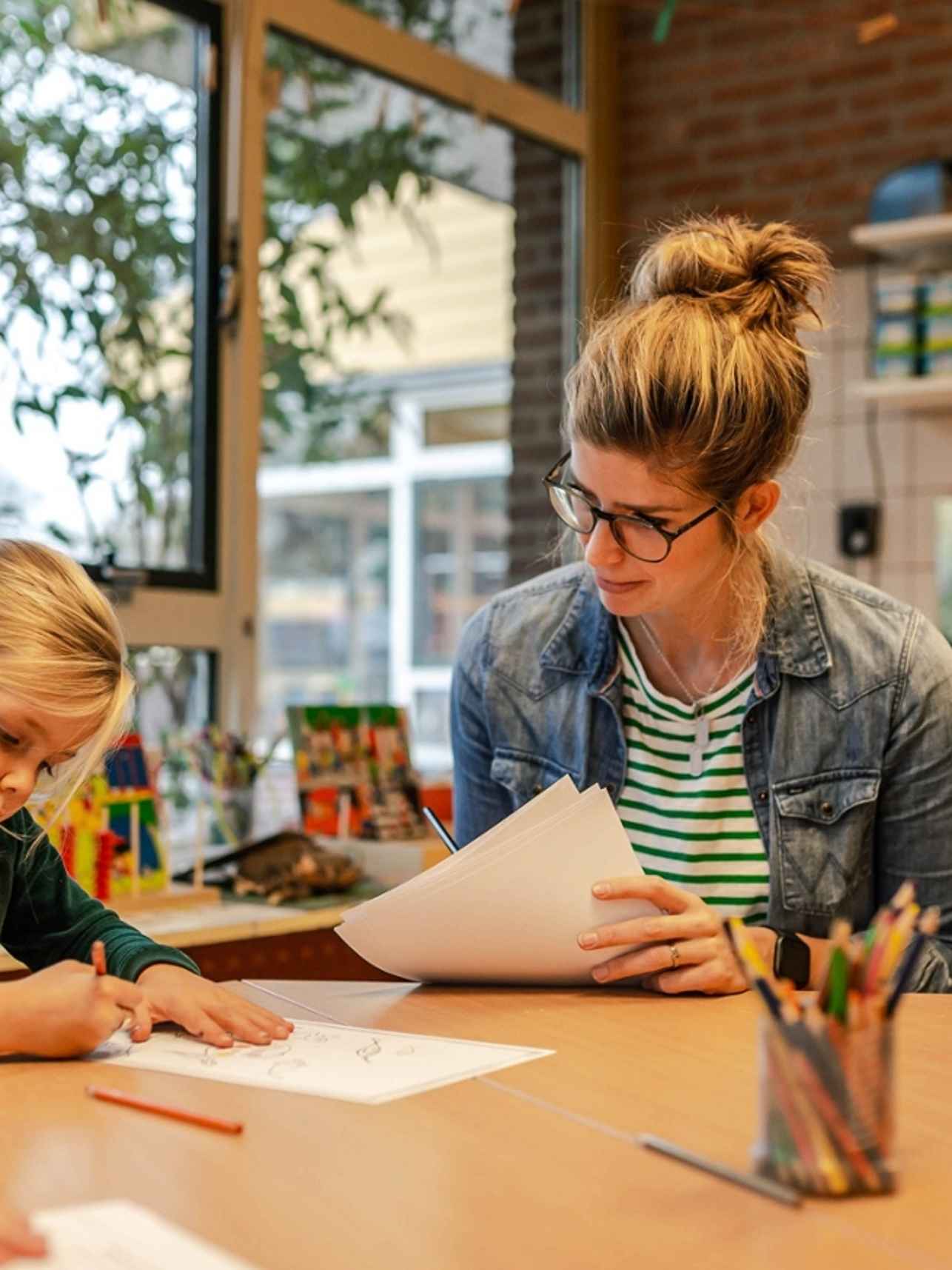 children doing writic assessment with teacher