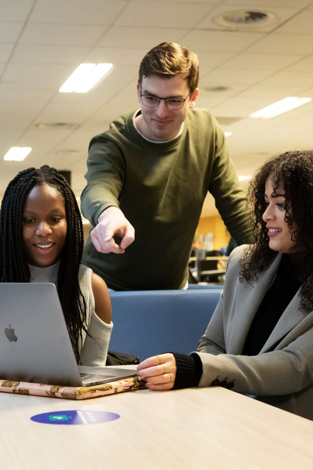 3 students with a laptop