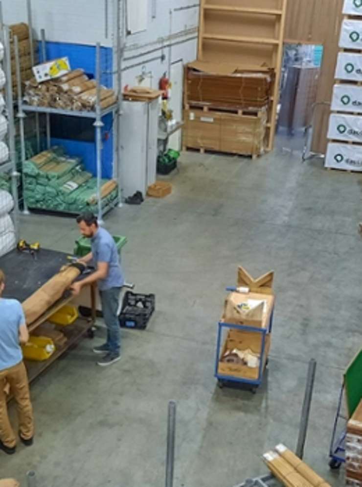 People working in warehouse.