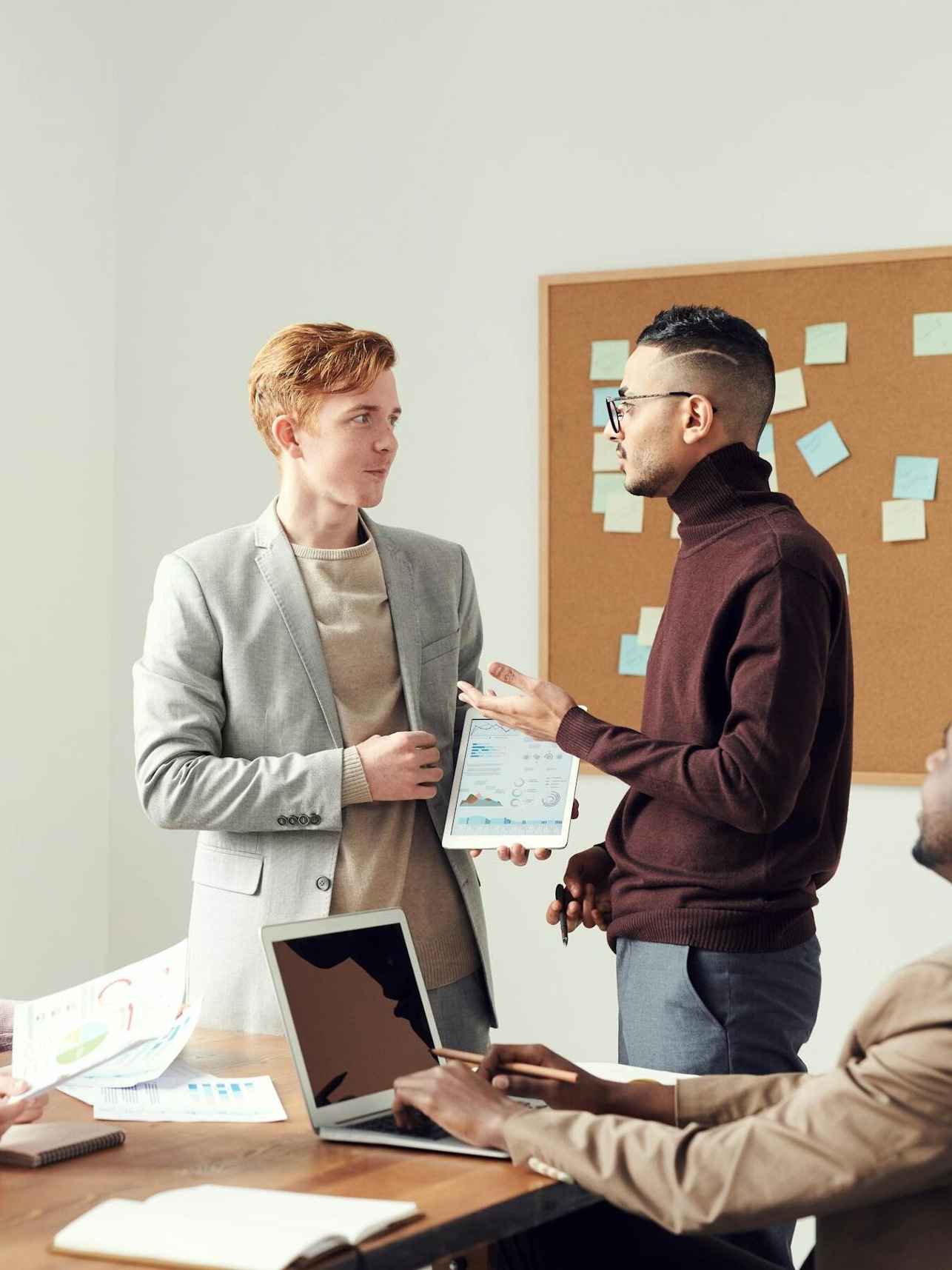 Two people discussing work.