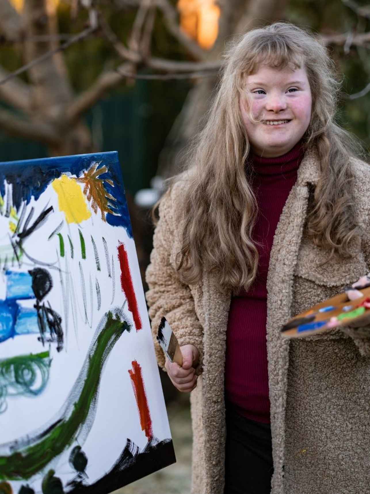 Schilderend meisje met down